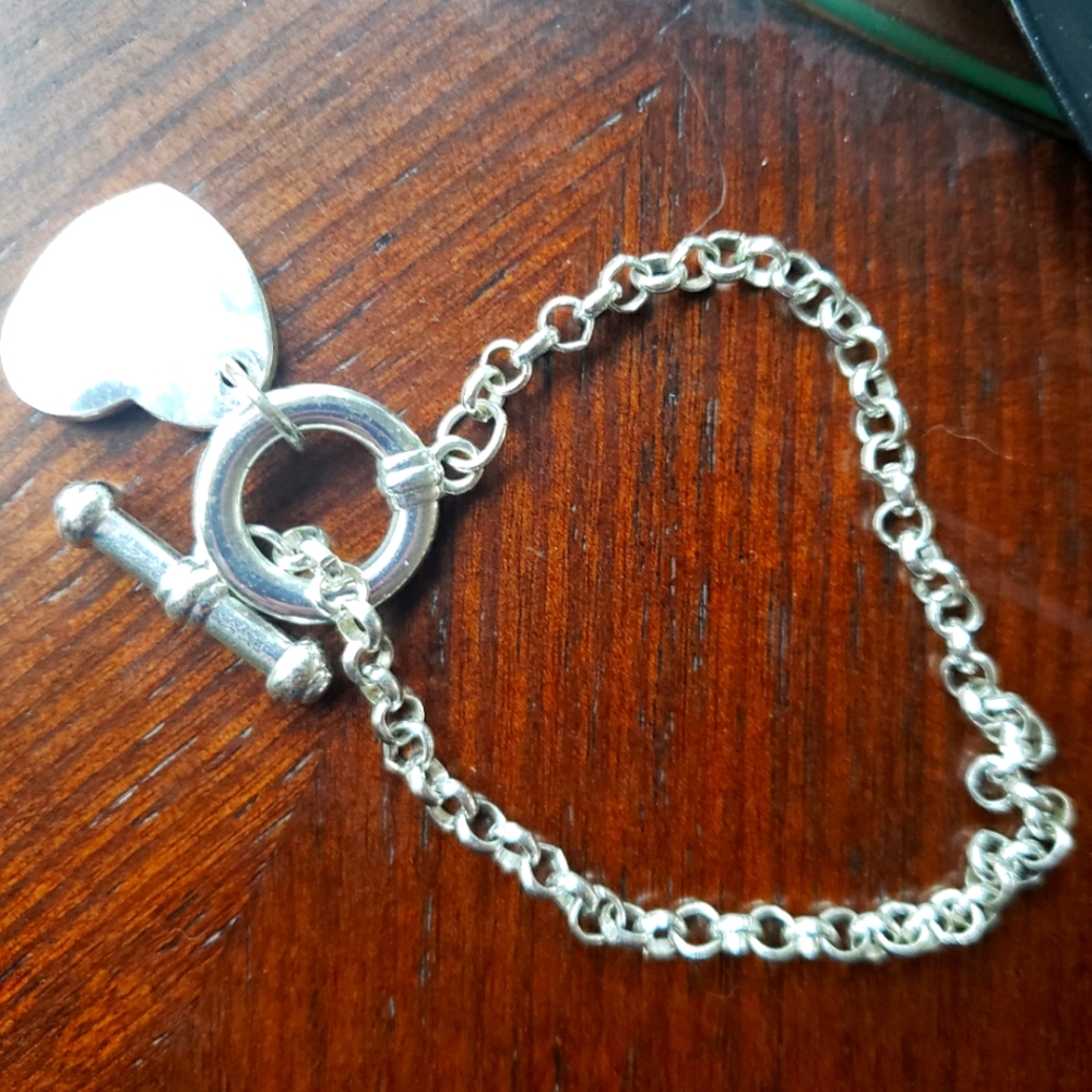 CHARMING Retired Premier Designs BraceletSilver plated bracelet, it is 7 1/2".
